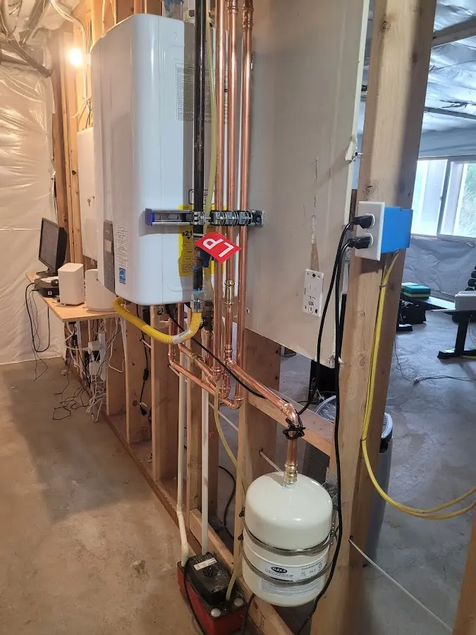 Licensed plumber repairing a kitchen sink in Denton